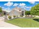 Charming home with a well-maintained lawn and vibrant landscaping at 2258 N Gentry --, Mesa, AZ 85213