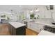 Bright kitchen with white cabinets, quartz countertops, and stainless steel appliances at 2258 N Gentry --, Mesa, AZ 85213