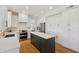 Contemporary kitchen with an island, white cabinetry, and modern appliances at 2258 N Gentry --, Mesa, AZ 85213