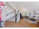 Bright and airy living space with hardwood floors and a staircase at 2258 N Gentry --, Mesa, AZ 85213
