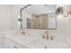 Modern bathroom featuring a double vanity with quartz countertop, stylish fixtures, and a large mirror at 22706 N 17Th St, Phoenix, AZ 85024