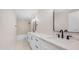 Stylish bathroom featuring double sinks, a white quartz countertop, and modern fixtures at 22706 N 17Th St, Phoenix, AZ 85024