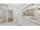 Modern bathroom with a double sink vanity, glass enclosed shower, and neutral color scheme at 22706 N 17Th St, Phoenix, AZ 85024