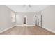 Bright bedroom featuring neutral walls, light wood floors, and multiple doorways at 22706 N 17Th St, Phoenix, AZ 85024