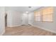 Well lit room with hardwood floors, stairs to the upper level, and two entry doors at 22706 N 17Th St, Phoenix, AZ 85024