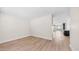 Bright, empty room with hardwood floors and a view of the kitchen through the doorway at 22706 N 17Th St, Phoenix, AZ 85024
