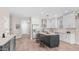 Bright kitchen features white cabinets, stainless steel appliances, light backsplash, and an island with seating at 22706 N 17Th St, Phoenix, AZ 85024