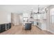 Spacious kitchen with white cabinets, stainless steel appliances, an island, and a chandelier at 22706 N 17Th St, Phoenix, AZ 85024