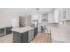 Modern kitchen featuring stainless steel appliances, white countertops, a large island, and plenty of counter space at 22706 N 17Th St, Phoenix, AZ 85024
