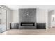 Bright living room featuring a modern fireplace and stylish built-in cabinets on either side at 22706 N 17Th St, Phoenix, AZ 85024