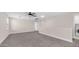 Spacious loft area with neutral walls, soft carpet, and large window for natural light at 22706 N 17Th St, Phoenix, AZ 85024
