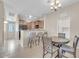 Eat-in kitchen with breakfast bar, dining table and chairs, and stainless appliances at 2727 N Price Rd # 6, Chandler, AZ 85224