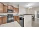 Well-equipped kitchen featuring modern appliances, breakfast bar, and ample counter space at 2727 N Price Rd # 6, Chandler, AZ 85224