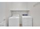 Clean laundry room featuring a white washer and dryer with a shelf at 2727 N Price Rd # 6, Chandler, AZ 85224