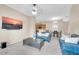 Comfortable living room with modern decor, neutral tones, and large TV mounted on the wall at 2727 N Price Rd # 6, Chandler, AZ 85224