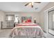 Comfortable main bedroom featuring stylish furnishings, soft lighting, and a view of the outdoors at 2727 N Price Rd # 6, Chandler, AZ 85224