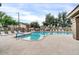 Sparkling community pool with lounge chairs and lush landscaping at 2727 N Price Rd # 6, Chandler, AZ 85224