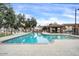 Inviting community pool area with lounge chairs and shade structure at 2727 N Price Rd # 6, Chandler, AZ 85224