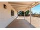 Covered back patio of home leading to yard with gravel at 3021 W Angela Dr, Phoenix, AZ 85053