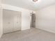 Neutral bedroom features carpet, closet, white walls, and a ceiling light at 3021 W Angela Dr, Phoenix, AZ 85053