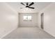 Bright bedroom with neutral walls, new carpet, a window for natural light, and updated ceiling fan fixture at 3021 W Angela Dr, Phoenix, AZ 85053
