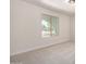 Neutral bedroom features carpet, white walls, and a modern window at 3021 W Angela Dr, Phoenix, AZ 85053