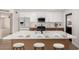 Modern kitchen with an island, white cabinets, and stainless steel appliances at 3021 W Angela Dr, Phoenix, AZ 85053
