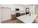 Modern kitchen with stainless steel appliances, updated cabinets, and a stylish central island at 3021 W Angela Dr, Phoenix, AZ 85053