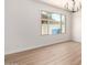 Bright living area with a large window providing ample natural light and a view of the outdoors at 3021 W Angela Dr, Phoenix, AZ 85053