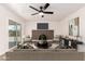 Comfortable living room with a fireplace, and sliding glass door leading to backyard at 3021 W Angela Dr, Phoenix, AZ 85053