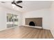 The living room offers sliding glass doors and a brick fireplace, creating a warm and inviting atmosphere at 3021 W Angela Dr, Phoenix, AZ 85053