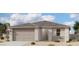 Charming single-story home with a neutral color palette, two-car garage, and manicured landscaping under a partly cloudy sky at 3334 E Valleyhigh Trl, San Tan Valley, AZ 85143