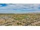 Sweeping aerial perspective of the expansive community, golf course, and serene lake at 3376 E Lafayette Ave, Gilbert, AZ 85298