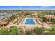 Aerial view showcasing the pool with lap lanes, comfortable lounges, and pergola-covered seating areas at 3376 E Lafayette Ave, Gilbert, AZ 85298