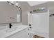 This bathroom features a modern vanity, toilet, and shower over a tub with updated hardware at 3376 E Lafayette Ave, Gilbert, AZ 85298