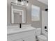 This bathroom features a vanity and toilet with sleek black hardware and bright lighting at 3376 E Lafayette Ave, Gilbert, AZ 85298