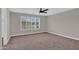 Bright bedroom features carpet, ceiling fan, and window with shutters providing bright, natural light at 3376 E Lafayette Ave, Gilbert, AZ 85298
