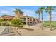 Clubhouse entrance has covered parking for golf carts and beautiful desert landscaping at 3376 E Lafayette Ave, Gilbert, AZ 85298