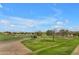 Beautiful golf course with mature trees and desert landscaping at 3376 E Lafayette Ave, Gilbert, AZ 85298