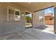 Covered patio with stucco walls and gravel landscaping offers a great outdoor living space at 3376 E Lafayette Ave, Gilbert, AZ 85298