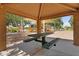 Picnic pavilion and playground with picnic table and seating surrounded by desert landscape at 3376 E Lafayette Ave, Gilbert, AZ 85298