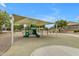 Community playground has sunshade to provide a comfortable play environment at 3376 E Lafayette Ave, Gilbert, AZ 85298