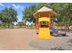 Community playground featuring a slide and swings under mature trees and clear, sunny skies at 3376 E Lafayette Ave, Gilbert, AZ 85298