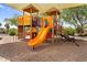 A community playground with shade covers over the play equipment and sandy play area at 3376 E Lafayette Ave, Gilbert, AZ 85298