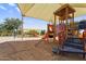 Shaded playground area with play equipment, swings, and desert landscaping at 3376 E Lafayette Ave, Gilbert, AZ 85298