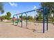 Swings at the community playground with landscaping in the background under blue skies at 3376 E Lafayette Ave, Gilbert, AZ 85298