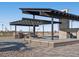 Enjoy this outdoor kitchen with grill, picnic tables, and covered area that's great for entertaining at 36860 W Santa Maria St St, Maricopa, AZ 85138