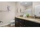 Bathroom features double sink vanity with granite countertops and decorative cactus artwork at 3766 E Ringtail Way, Phoenix, AZ 85050