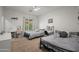 Large bedroom with two beds, ceiling fan, and windows providing natural light at 3766 E Ringtail Way, Phoenix, AZ 85050
