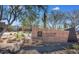 Community clubhouse featuring attractive rock signage with desert landscaping and attractive architecture in background at 3766 E Ringtail Way, Phoenix, AZ 85050